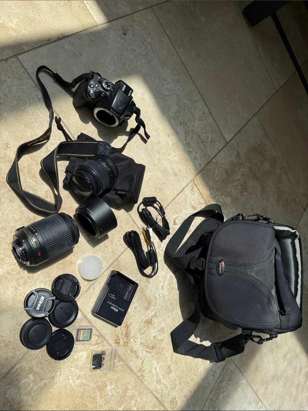 Nikon D5100 DSLR camera, 18-55mm lens, extra zoom 55-200mm, accessories, & bag